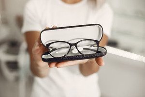 new eye glasses women holded in a glasses case