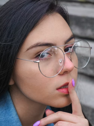A girl wearing transparent eye frame