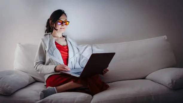 A girl working on computer while working on her computer